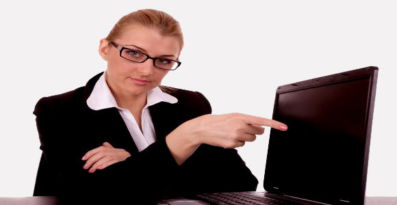 Business woman to point on laptop